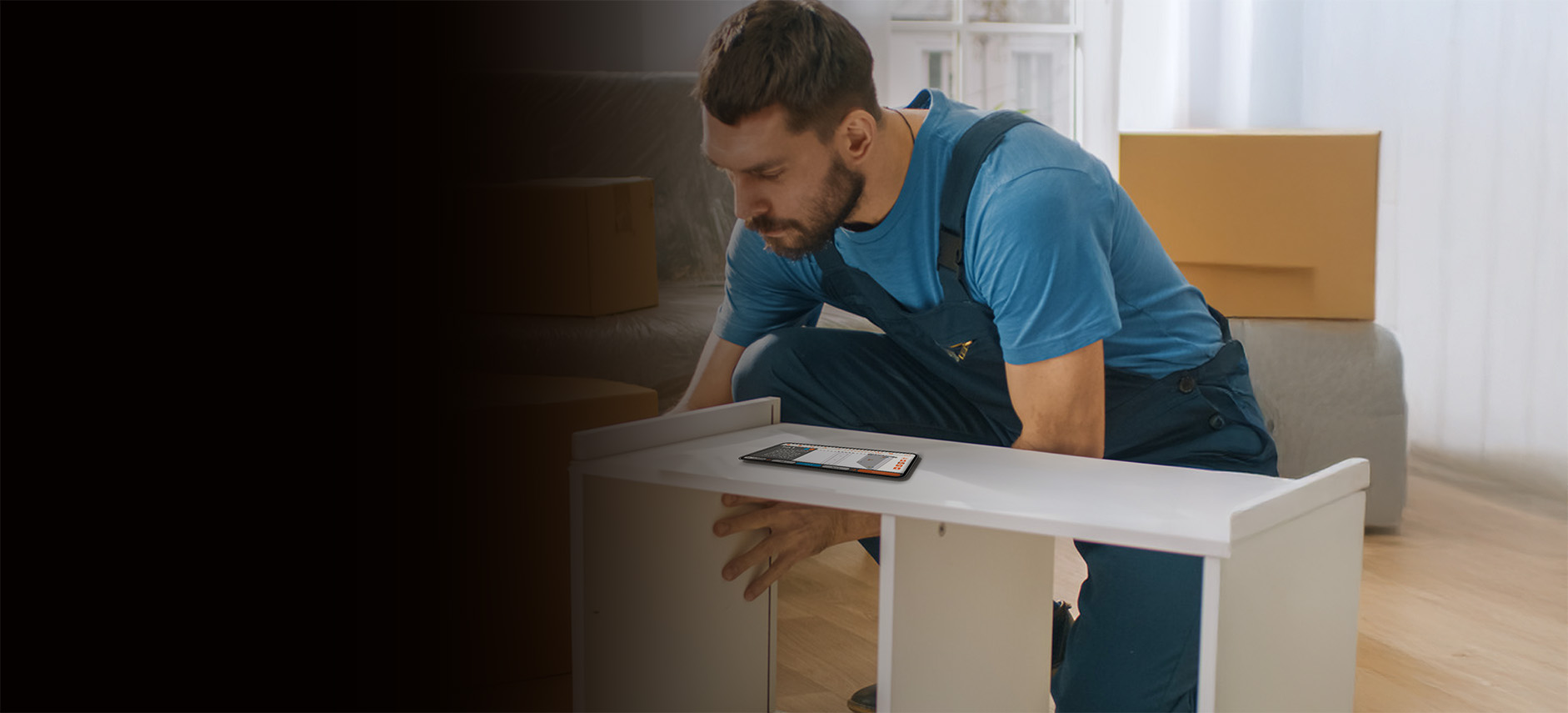 Furniture installer assembling a table with guidance from the Build It Up mobile app